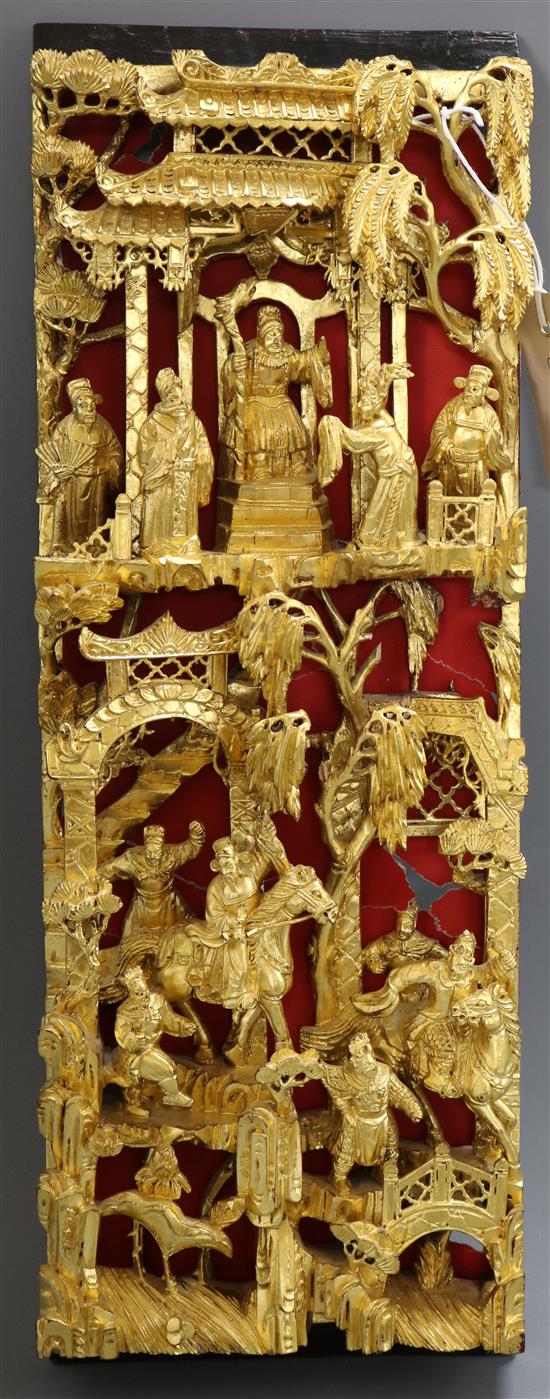 A Chinese giltwood wall panel, carved with figures length 49cm